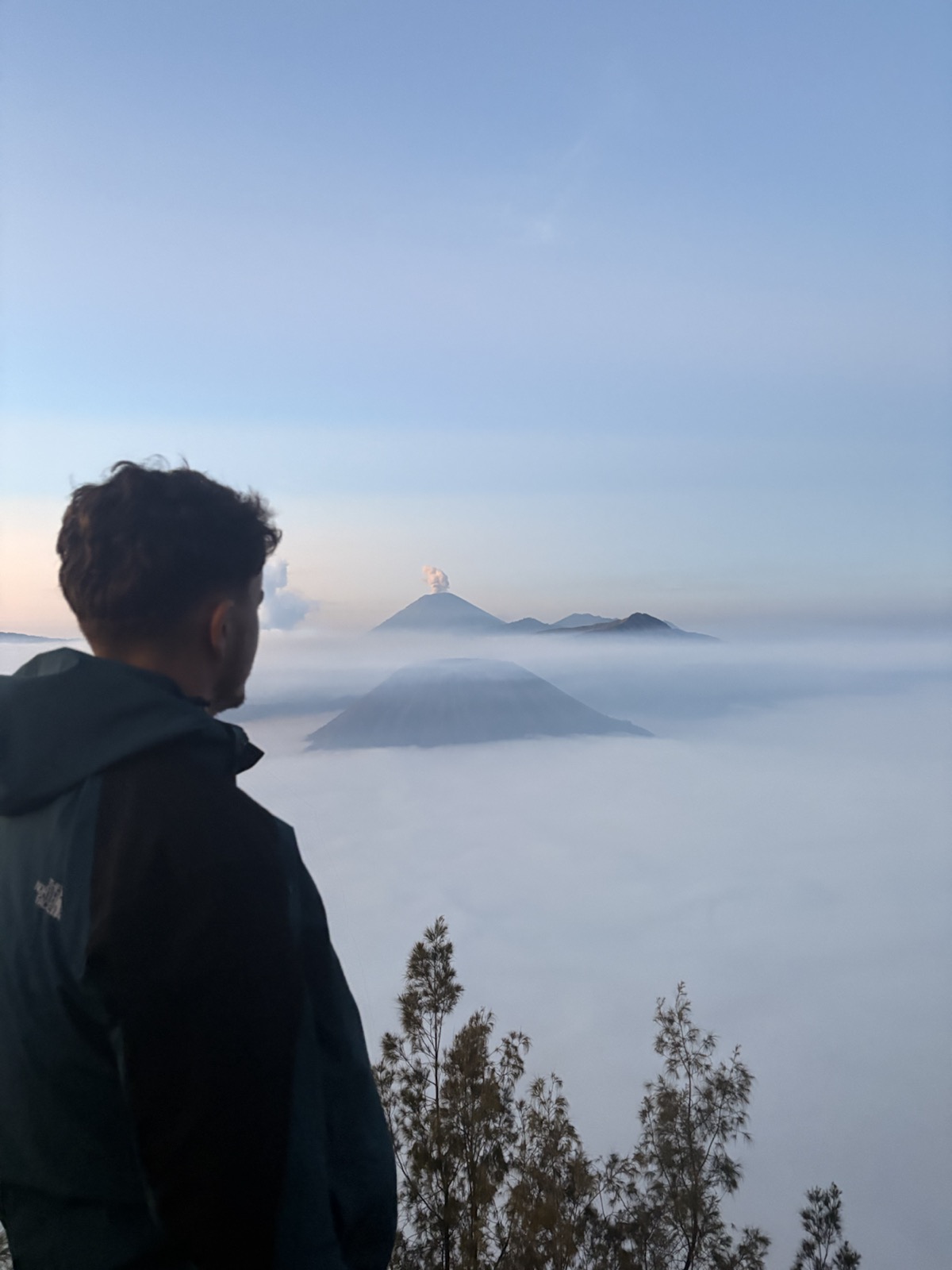 Ollie looking across volcanoes at sunrise